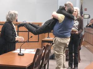 Sparta Councilman Daniel Chiariello’s brother Roy lifts him in the air after he takes the oath of office. (Photos by Kathy Shwiff)