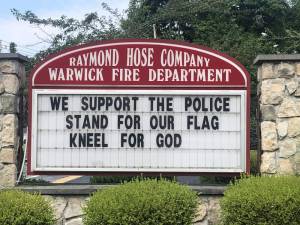 This sign that went up the week before July 4 at the firehouse on West Street felt like “a slap in the face” to residents of color. Photos by Daniel Mack.