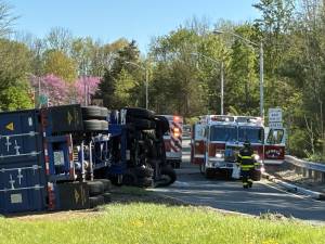 A dump truck is on its side on the northbound off-ramp of Route 15 leading onto Route 517 in Sparta on Wednesday morning, April 30. (Photo by Jeanne Straus)