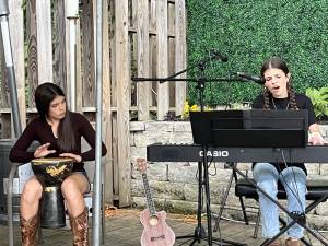 Chloe and Lily Geuther of Franklin started by singing at the open mic night at the Homestead Rest in Sparta. (Photos by Taryn Geuther)