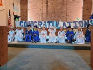 The preschool graduates sit on the altar of the Lutheran Church of Our Savior in Stanhope. (Photos by Theresa Esposito)