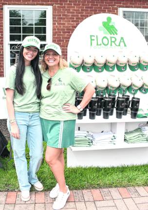 Flora Foundation founders Colleen Garone and Joanna Flora pose for a photo.