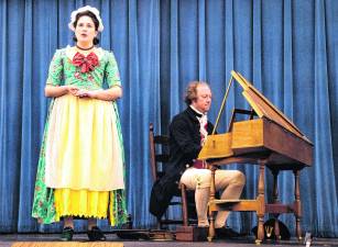 Eliza Lichack sings while Erik Lichack plays the harpsichord.