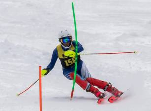 Kanna Pasunuri, captain of the varsity boys team, competes in the second slalom race of the season Jan. 29 at Winter4Kids. He placed third with a combined time of 1:31.39. (Photos by Paul Lopez)