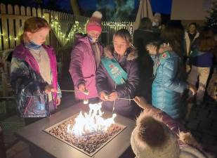 Girl Scouts bring holiday cheer to Westwind Manor
