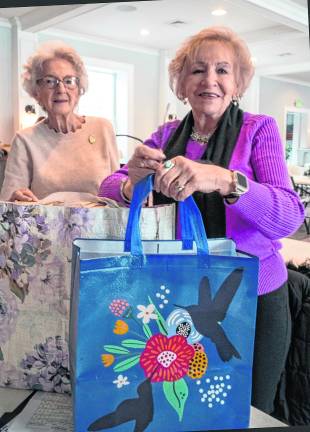 Maryane Bayliss and Joyce Antonelli prepare to deliver cookies.