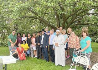 Area religious leaders gather with community members to bless the new location of the Sparta Community Food Pantry.