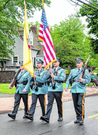 The Sparta police color guard marches in the parade.
