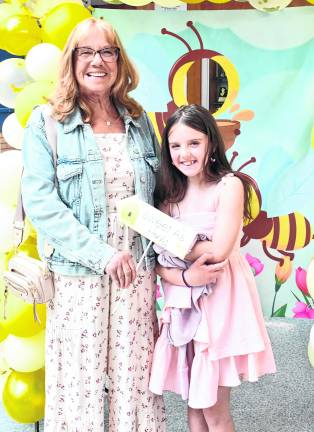 Nancy Morris and Sasha Lewis pose for a photo.