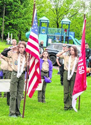 Sparta scouts salute at the ceremony.