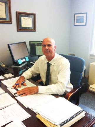 PHOTO BY LIAM DONOVAN Retiring Sparta Schools Superintendent Dennis Tobin at his desk.