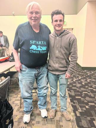 Tom Murray, coach of the Sparta High School chess team, with Brendan Wick.