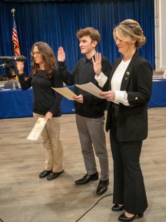 From left, Jennifer Lonsky, Chad Wood and Kaitlin Gagnon take the oath of office.