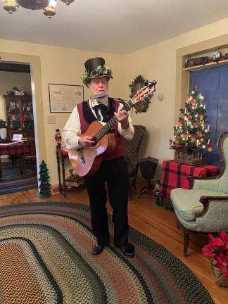 Don Thoenig enjoyed being the minstrel at Saturday's 12th Night celebration.