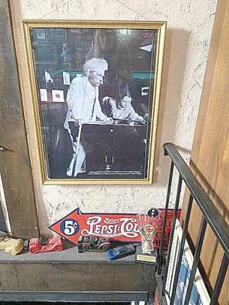 Mark Twain playing pool, possibly on the same pool table.