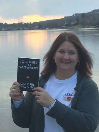 Valerie Monro poses with her new book Journey to Nagwanis. (Photo provided).