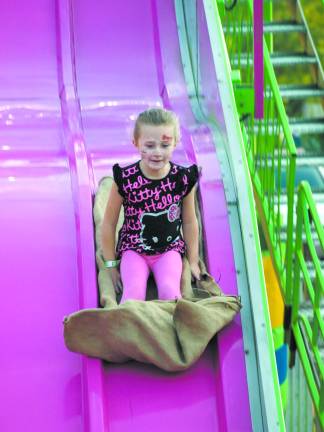 Lyla Horowitz, 6, of Sparta, on the Giant Slide Friday night.