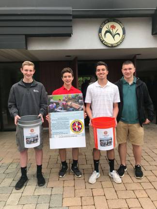 Squires Will Englehardt, Joe Pauls, Jimmy Bliss, and Paul McFadden volunteering to help the Puerto Rico fundraiser