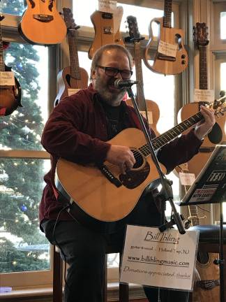 Bill Ihling enchants visitors with his acoustic guitar playing and singing at a New Hope, PA coffee house.