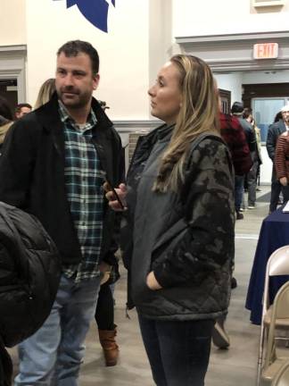 Christina Korines, right, complained to Sparta school officials about “The Upside of Unrequited,” which the school board removed from the middle school library at its meeting Feb. 23.