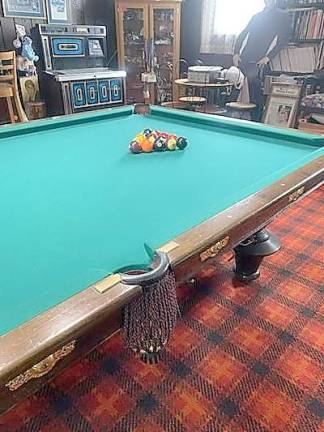 A pool table thought to have been used by Mark Twain, part of DePeppo’s collection.