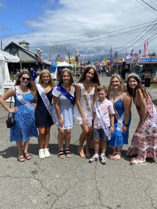 FR23 Queen of the Fair contestants pose with Little Mister Sussex Borough at the New Jersey State Fair. From left are Miss Stillwater Delaney Burke, Miss Andover Amanda Clearly, Miss Vernon Emily Klump, Miss Hardyston Kayla Van Ginneken, Little Mister Sussex Borough Cole Choma, Miss Wantage Mackenzie Baker and Miss Sandstone Danielle Sharry. (Photo by Deirdre Mastandrea)