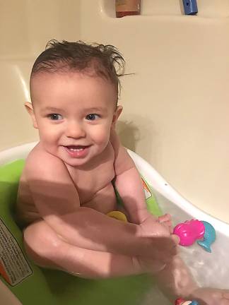 Taking a fun bath at Nana’s House! Photo courtesy of Mary.