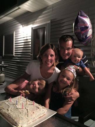 Drew surrounded by his family.