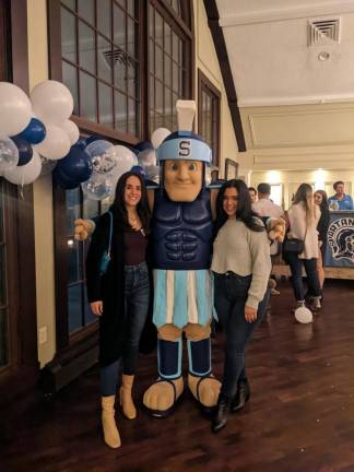 Brittany Monroe-Guzman and Mariah Perez with Sparty.