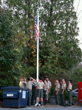 Boy Scout troop 276 tends to the flag
