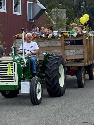 A tractor pulls a wagon full of riders during Sussex County Day on Sunday, Sept. 17 at the fairgrounds in Augusta. (Photos by Deirdre Mastandrea)