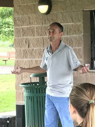 Four-time Olympian Marcus O'Sullivan talks to young runners. Photos by Laurie Gordon