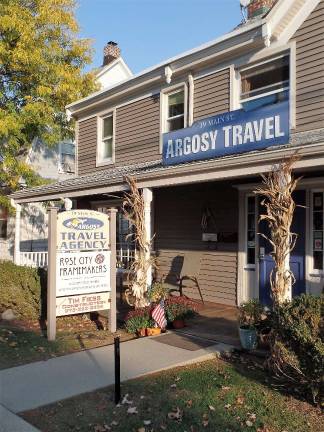 Rose City Frameworkers is located across the hall from Argosy Travel on Main Street.