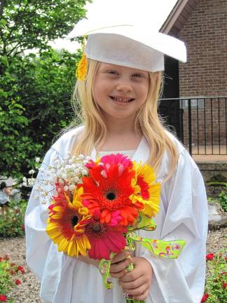 Charlotte Cady, 5, at the preschool graduation.