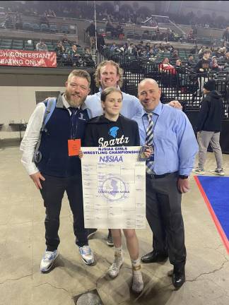 From left, Sparta High School wrestling head coach Daniel Trappe, Paige Weiss and Principal Ed Lazzara with assistant coach John Procopio standing behind Weiss.