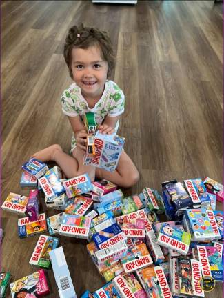 Blakely Boyle, who is undergoing treatment for T-Cell lymphoblastic lymphoma, is shown with bandaids.