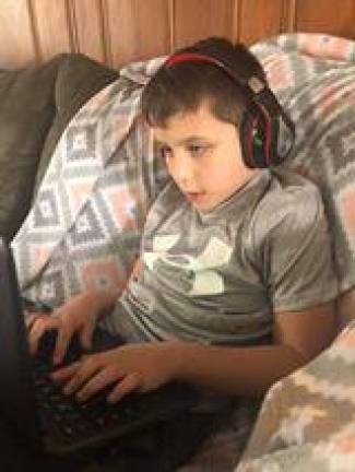 “Distance learning isn’t hard so far,” said 4th-grader Liam Connelly. “But it’s really weird doing my school work at home.”