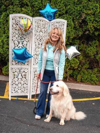 Sue Russo with Leo, a Golden Retriever and winner in the sporting dog category.