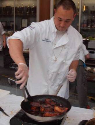 Team Three member Matt Boffa cooks pork loin