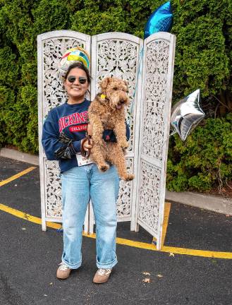 Jess Berghoffer with Spencer, a Welsh terrier and winner in the terrier dog category.