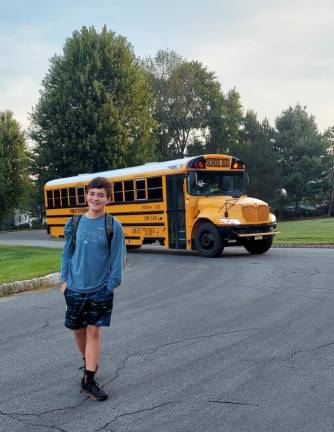 SK1 Timothy catches the bus for his first day of eighth grade. (Photo provided)