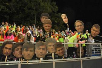 There is no spirit like Sparta spirit! Supporters hold cardboard cut outs of Sparta football players at the Friday, Oct. 19, 2019 football game against Randolph Rams.