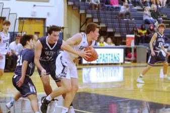 Sparta's Mike Piwko controls the ball in the first half. Piwko scored 2 points.