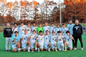 The Wallkill Valley Regional High School boys soccer team. At left is athletic trainer Mike Armstrong. Second from right is assistant coach Ryan Neal, and head coach Sean Neal is at right. Team captains are Kooper Nicolai (17), Ivan Reyes (7) and Dennis Aungst (20). (Photo provided)
