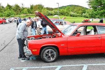 Residents look at entries in the sixth annual car show Saturday, May 24 at Sparta Evangelical Free Church. The proceeds benefit the Single Moms Oil Change Program. (Photos by Maria Kovic)