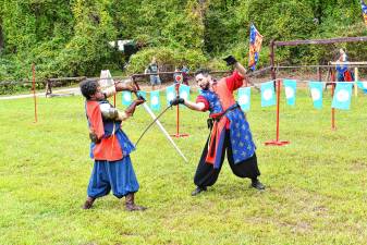 SRF1 Two knights demonstrate their sword-fighting skills Sunday, Sept. 7 at the Sparta Renaissance Festival. (Photos by Maria Kovic)