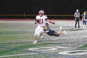 <b>VH1 </b>High Point ball carrier Brendon Lehman is caught from behind by Vernon defender Gavin Bruno in the second quarter. The Vikings won, 35-28, at home Friday, Oct. 3. (Photos by George Leroy Hunter)