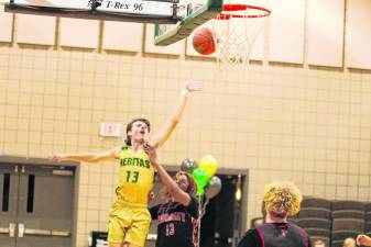 Veritas Christian Academy forward Nicholas Jetton releases the ball in the Dec. 21 game against Harmony Christian of New York. Veritas won, 67-18, and he scored eight points. (Photo by George Leroy Hunter)