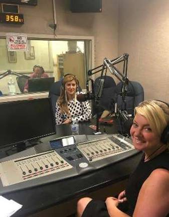 Erika Lupo-Beebe interviews celebrity stylist Engie Hassan while taping a broadcast of her radio show, Women in the Loop.