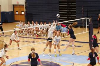 Sparta and Mendham battle above the net in their game Sept. 7. (File photo by George Leroy Hunter)